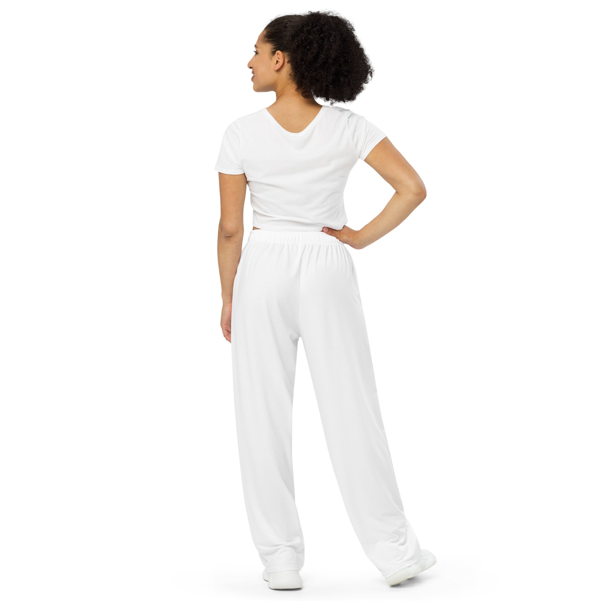 Woman wearing a white jumpsuit on a white background