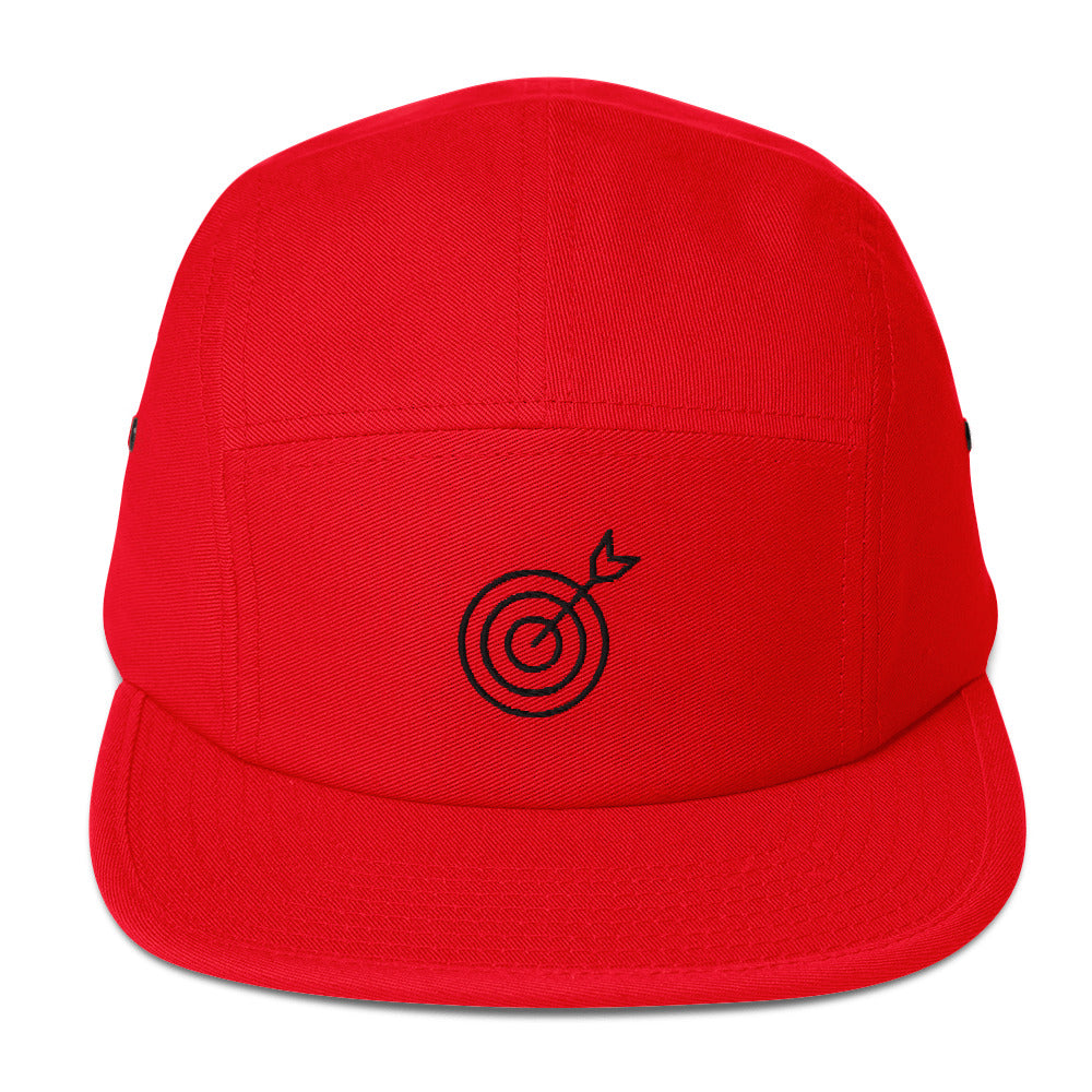 Red cap with a black target and arrow design on a white background