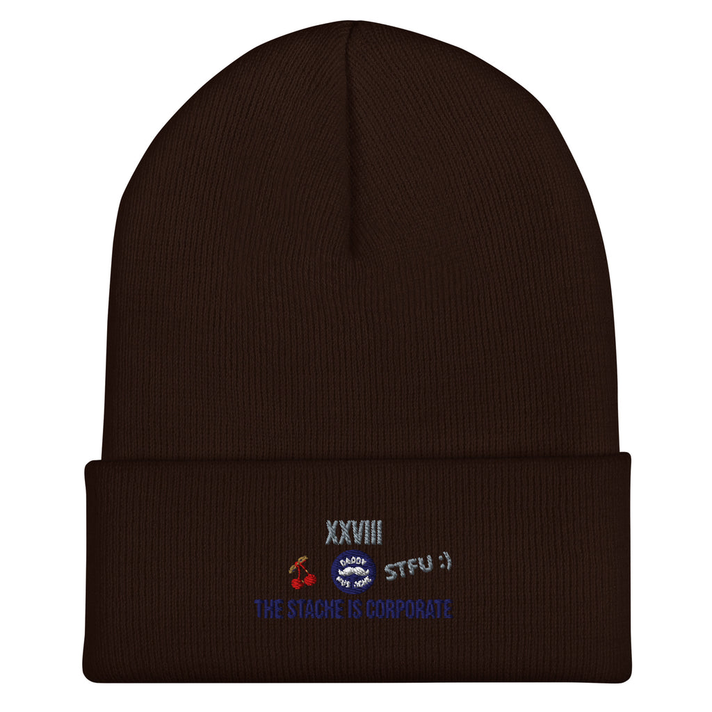 Brown beanie with embroidered text and graphics on a white background