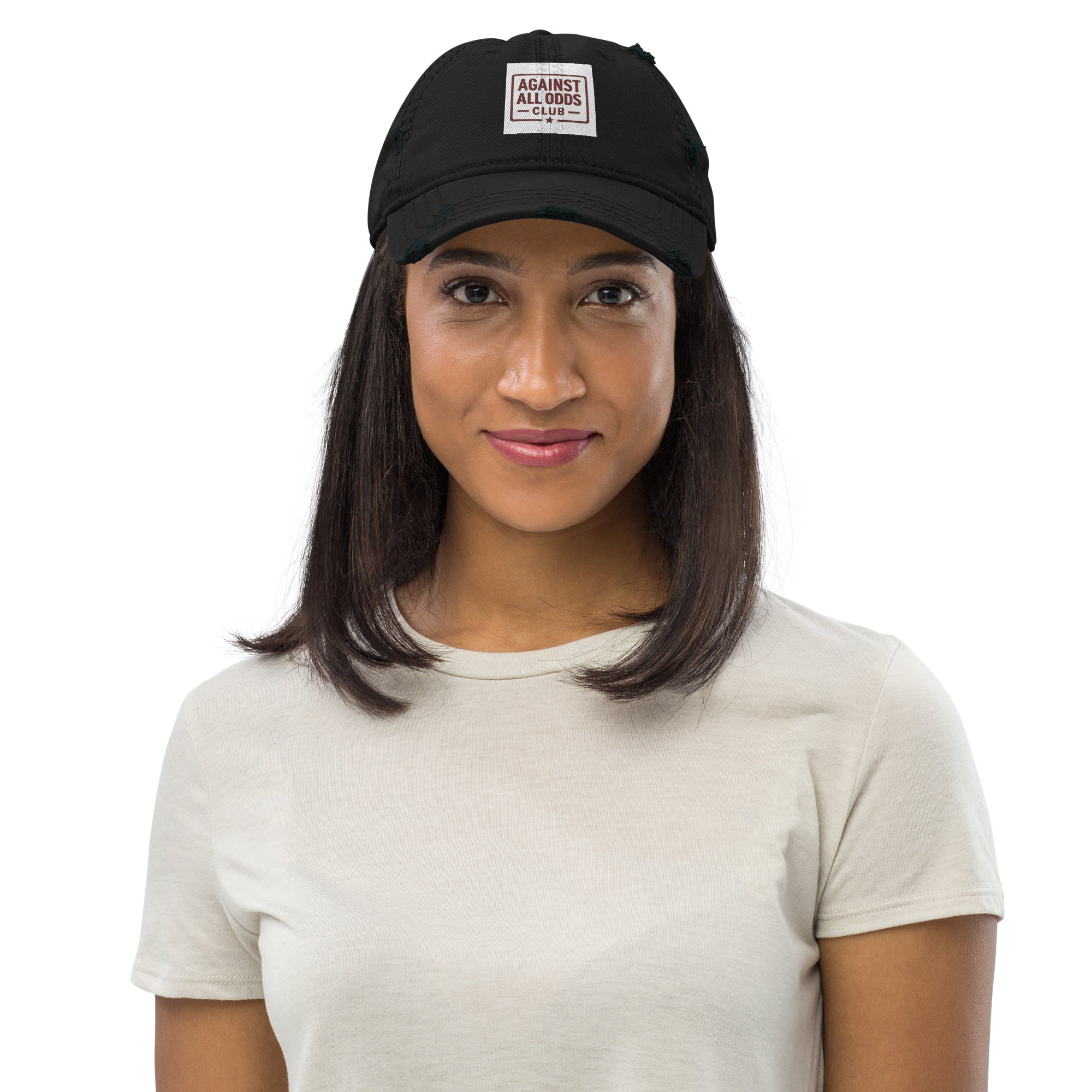 Woman wearing a black cap with a logo on a white background