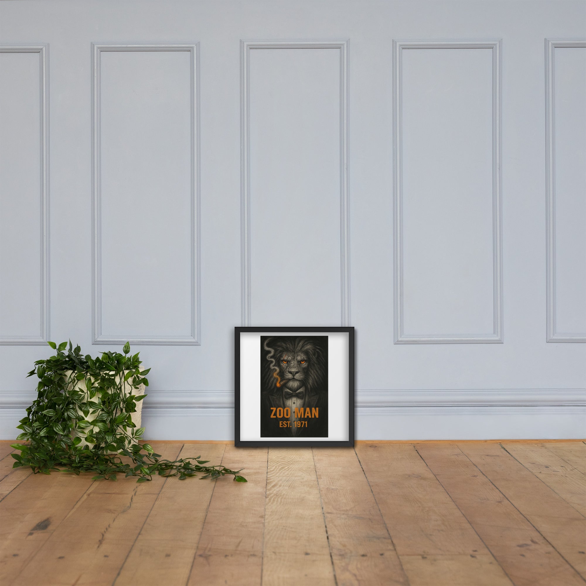 White chair and potted plant against a gray wall with framed artwork by Chris McGrath and his company Daddy Mustache.