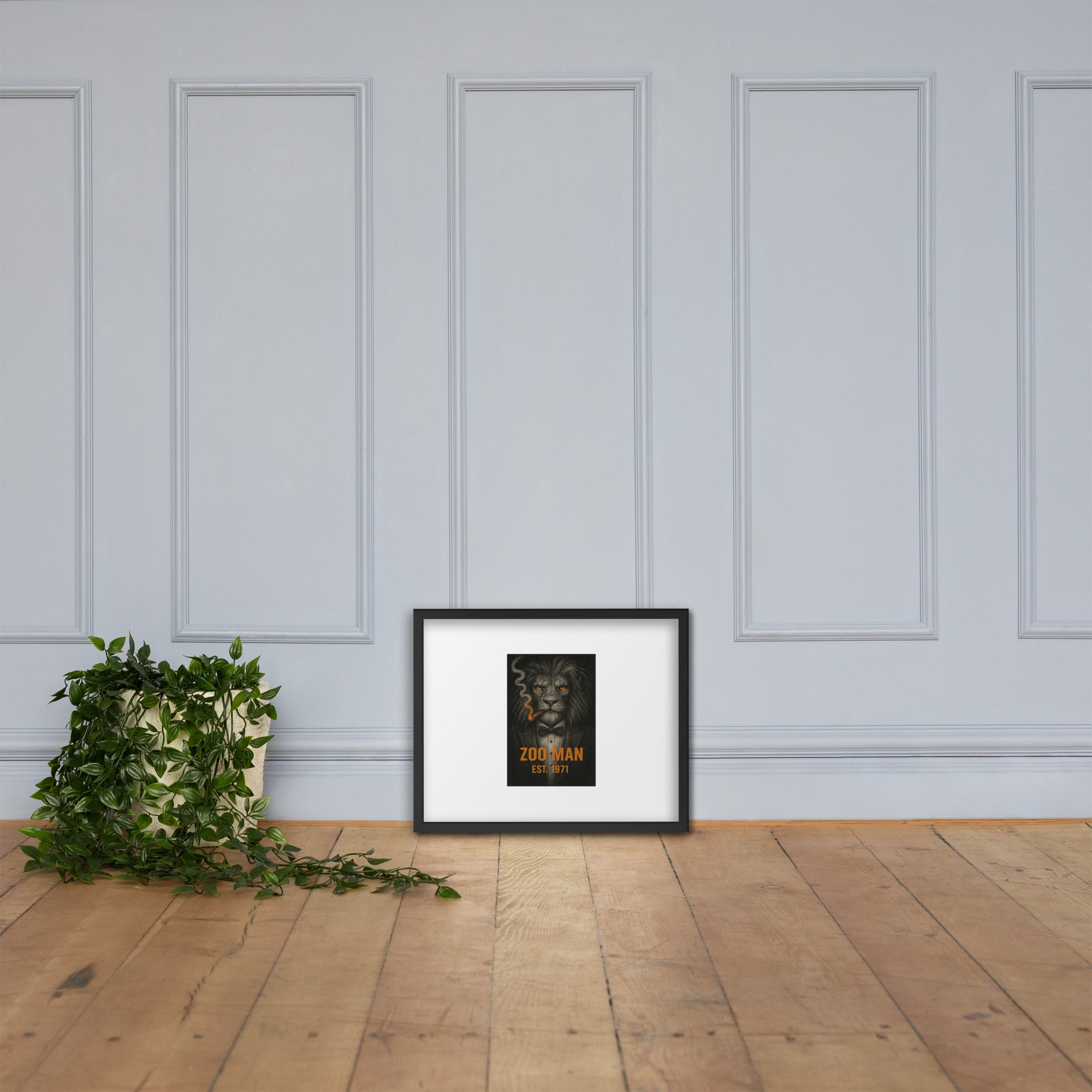 White chair and potted plant against a gray wall with framed artwork by Chris McGrath and his company Daddy Mustache.