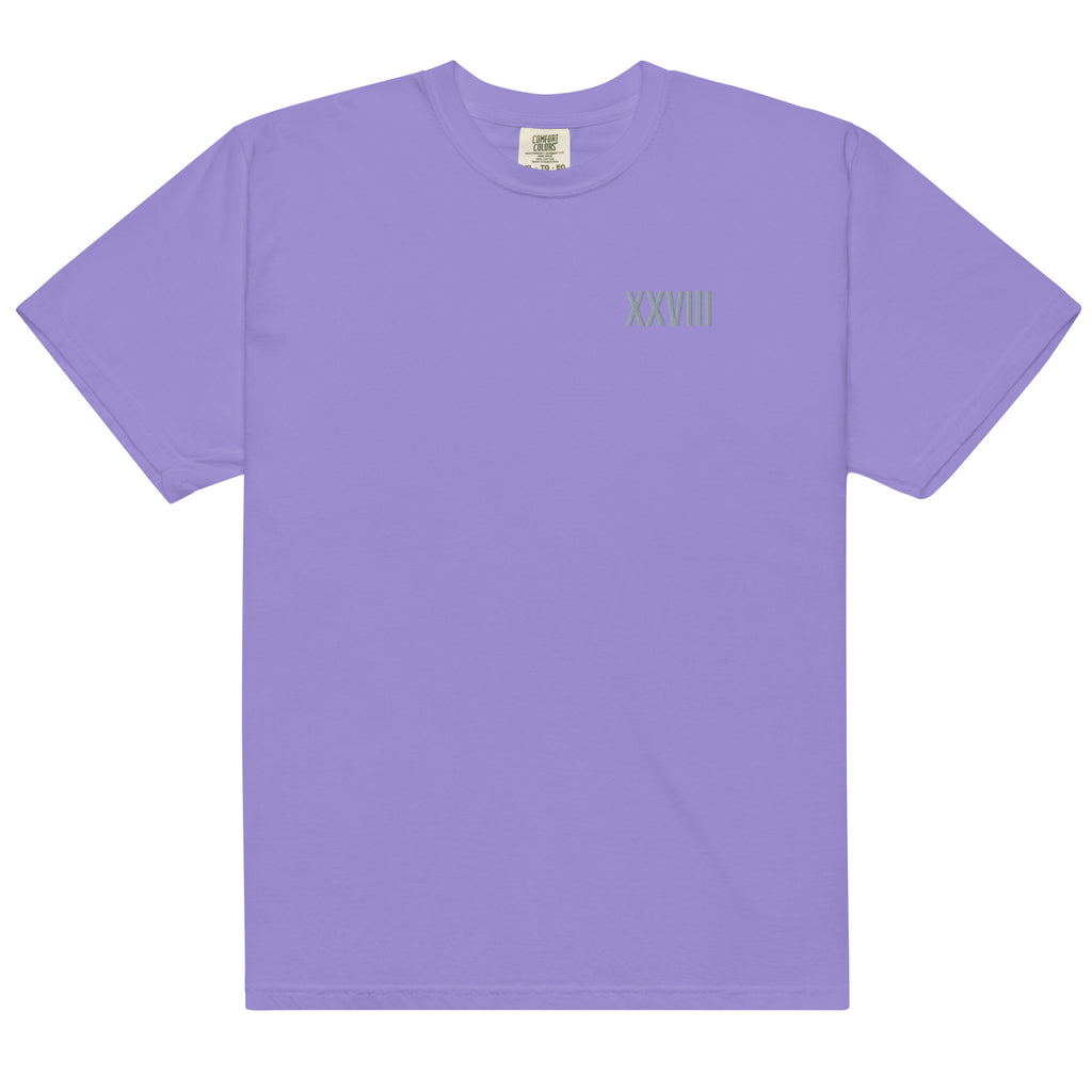 Purple t-shirt with a small logo on the chest against a white background