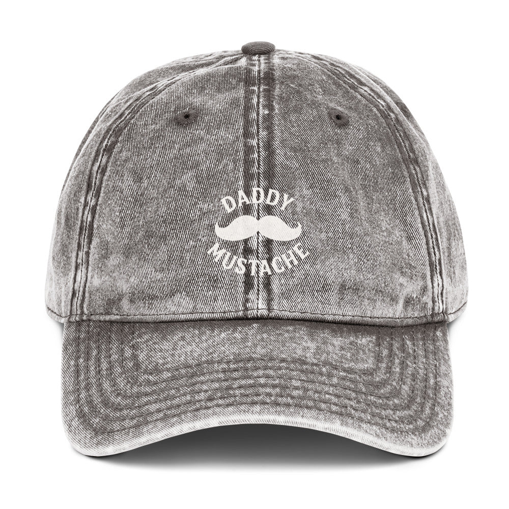 Gray denim cap with 'Daddy Mustache' text and mustache graphic on a white background